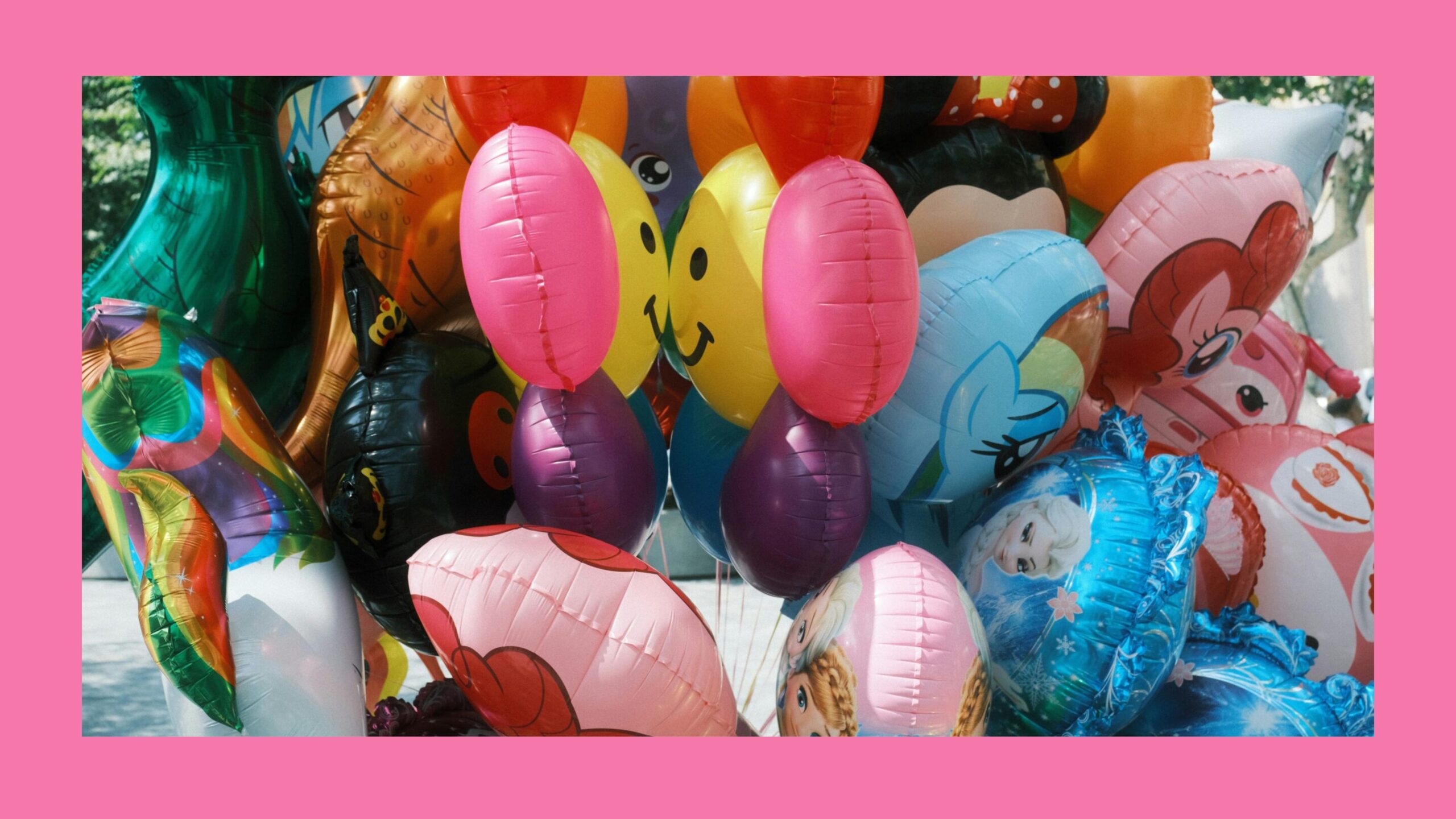 A grouping of colorful helium foil balloons.